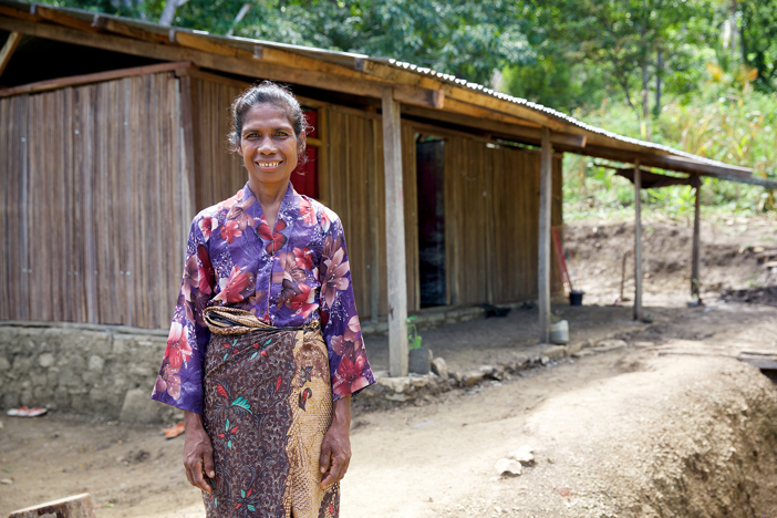 Martina Standing In Front Of Her Home