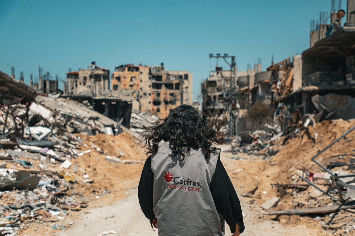 A Caritas Worker Walks Through The Destruction In Gaza Photo Credit Caritas Jerusalem