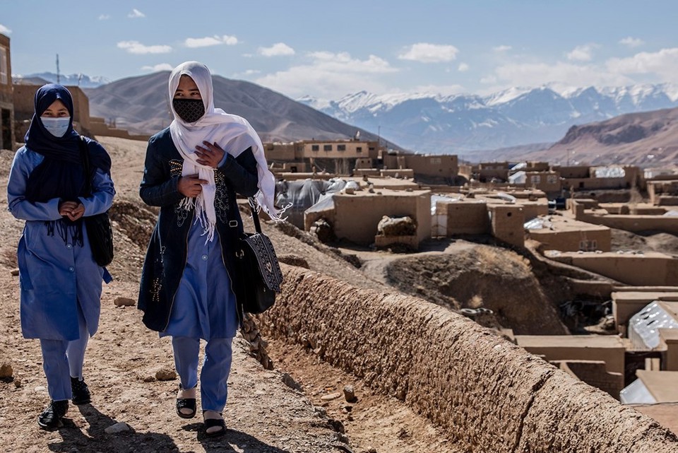 Afghan women walking down the street with protective face masks