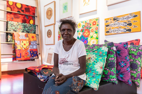 Janice sitting in the shop at Djilpin Arts in the Northern Territory, Australia