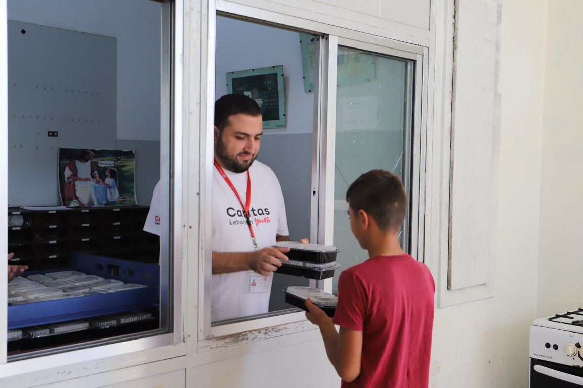 Caritas Lebanon Youth Hands Meals Out To Those In Need