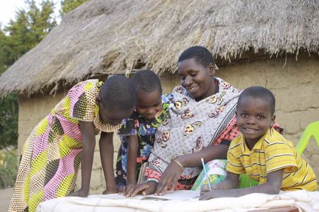 Maria reading with three of her children