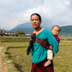 NEPAL Woman Carrying Her Baby In Fields