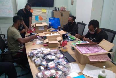 Group of people with hygiene kits in PNG