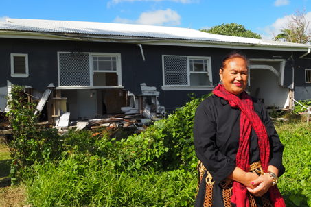 Tupou in front of her family's home in Tonga