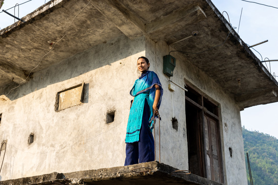 Laxmi Outside Her Home