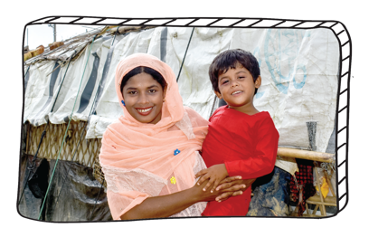 Woman holding her daughter in refugee camp.