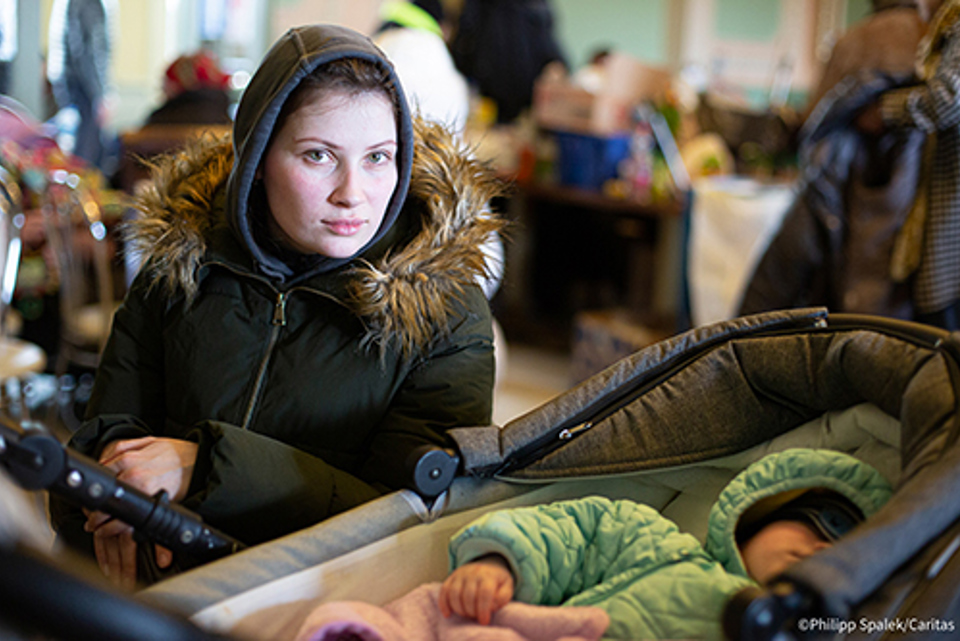 Woman In Ukraine With Her Baby