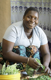 Maria preparing lunch in her home in Tanzania