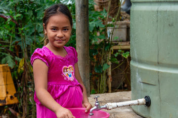 Leaia Children Using Water Tank