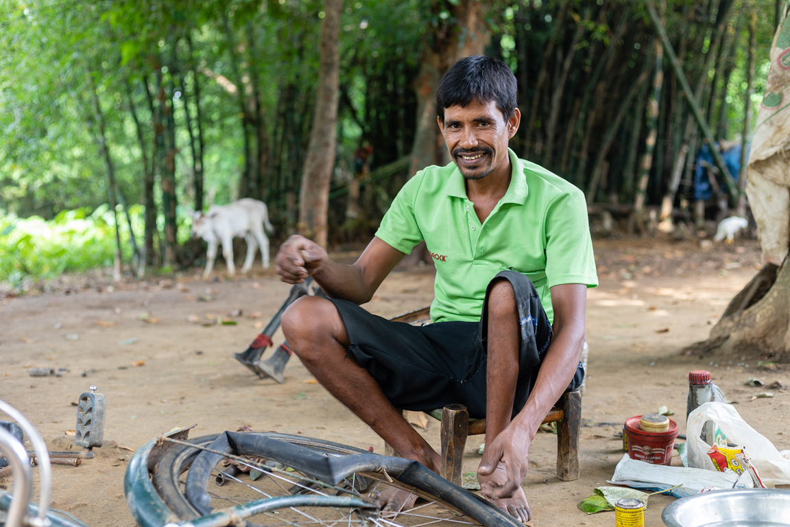 Biru repairing a bike