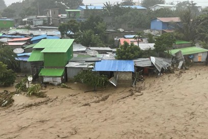 Houses swept away by an overflowing Comoro River. Photo: Dan Convoy/CRS