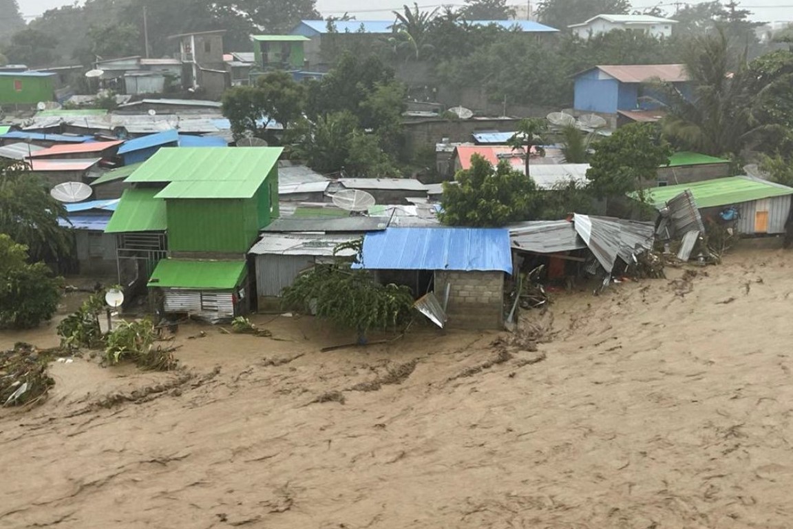 Houses swept away by an overflowing Comoro River. Photo: Dan Convoy/CRS