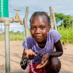 Thandolwayo collecting water in Zimbabwe