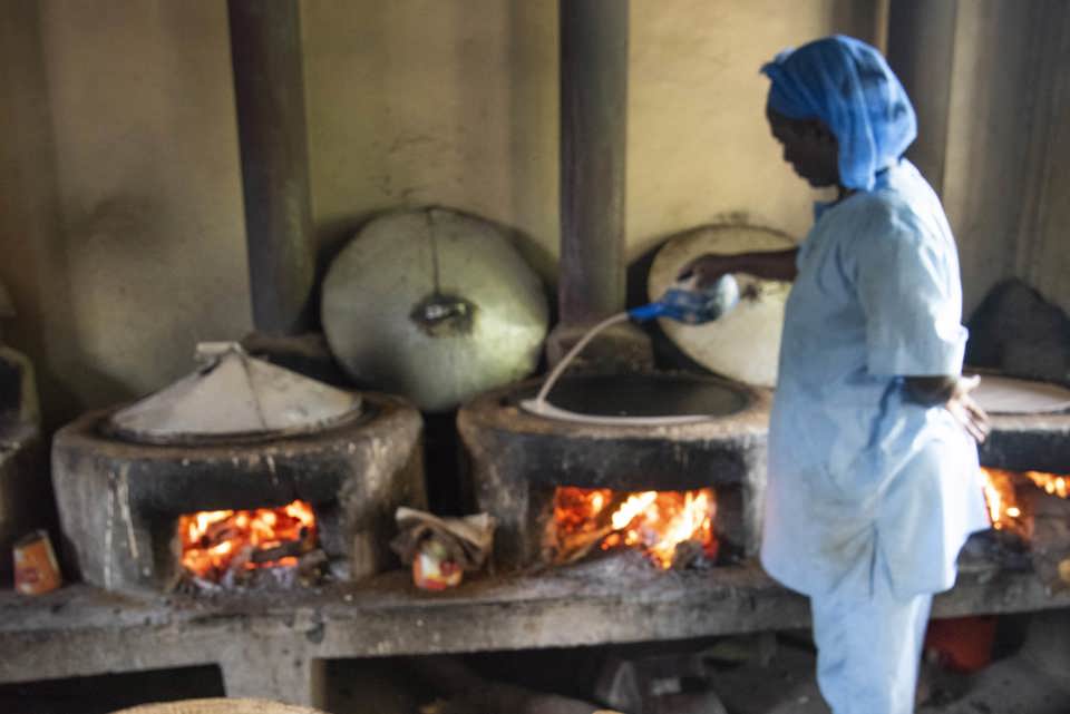 Staff member cooks injera – a local bread – at a missionary-run health facility