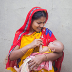 Woman holding baby in Bangladesh